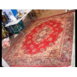 Middle Eastern style carpet with red ground floral
