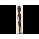 A large carved antique wooden female figure from t