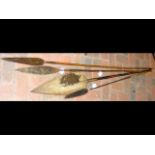 Four antique African spears with wooden shafts