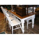 A shabby chic long pine dining table with the matc