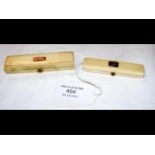 An ivory toothpick case with gold mount and one ot