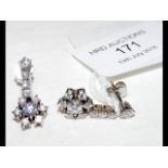 A pair of diamond cluster drop earrings in present