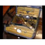 Vanity travelling case with some silver top jars,