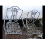 Pair of decorative cast metal garden chairs