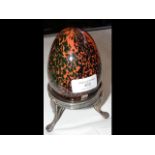 A Mdina studio glass egg on plated stand - 17cm hi