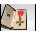 An MBE medal in presentation case to Patrick Keati