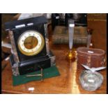 A mantel clock, binoculars, ashtray, two vases