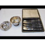 A silver bowl, ashtray and silver handled butter k