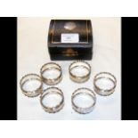 A cased set of six silver napkin rings