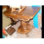 Victorian fold-over games table with shaped base