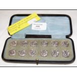An unusual set of twelve silver buttons with Birmi
