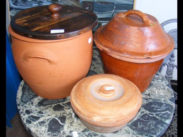 Terracotta bread bin and two others