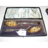 A pair of silver berry spoons in presentation case