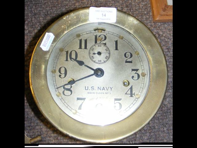 An 18cm diameter brass cased US Navy desk clock No