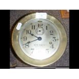 An 18cm diameter brass cased US Navy desk clock No