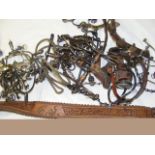 A collection of various Mexican spurs, horse bits,