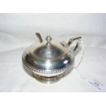 A silver mustard pot with glass liner and spoon