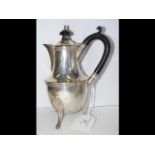 An 18cm high silver wine jug with lid, having Ches