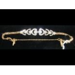 A lady's attractive diamond bracelet in 14ct gold