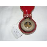 A pocket barometer in presentation case