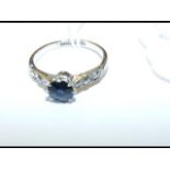 An 18ct & platinum gold sapphire and diamond ring