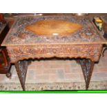 A decorative antique Chinese folding desk with pro