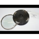 An antique white metal mounted magnifying glass -