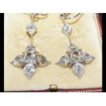 A fine pair of antique diamond drop earrings in pl
