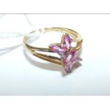 A 9ct gold pink sapphire and diamond ring