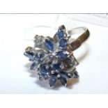 A sapphire and diamond floral cluster ring in 14ct