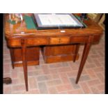 A 19th century fold-over games table on square tap