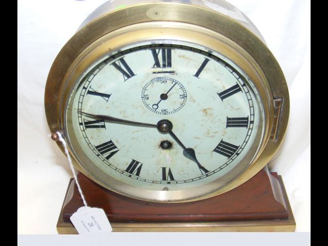 A ship's mantel clock with white enamel dial and s