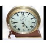 A ship's mantel clock with white enamel dial and s