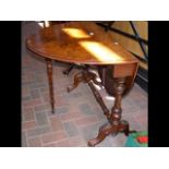 A Victorian walnut Sutherland table on turned supp