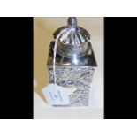 A late Victorian silver tea caddy with repousse de