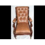 A Regency recliner armchair with brown leather bac