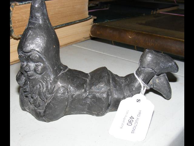 A small lead figure of gnome laying down - 16cm