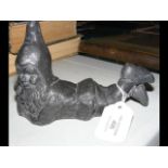 A small lead figure of gnome laying down - 16cm