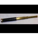 A four draw brass telescope