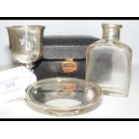 A three piece silver home communion set in travell