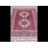 Middle Eastern rug with geometric border and centre