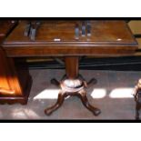 A 19th century rosewood fold-over games table