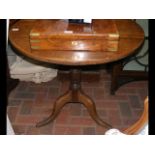 An oak snap-top tripod table