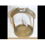 A Chinese brass stirrup with chased decoration