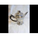 Decorative silver teapot with ebony handle and rep