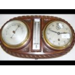 An antique clock, barometer, thermometer set in ro