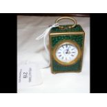 A miniature antique travelling clock - enamel dial