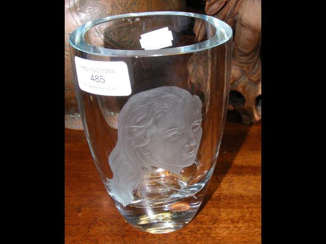 A Scandinavian studio glass vase with engraved por