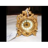 A decorative Rococo style side clock - 10cm high