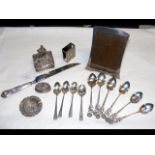 A silver photo frame, spoons, etc.